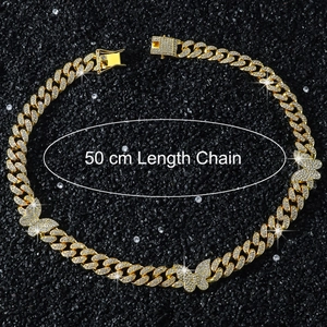 Close-up of 50cm golden Cuban link chain with iced-out butterfly charms and diamonds