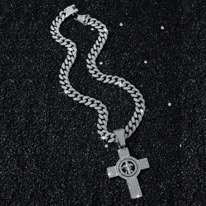 Iced-out Cuban chain necklace with a spinning cross pendant in silver hip-hop style