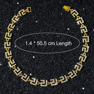 Detailed view of 14mm gold-plated Greek key link chain with iced out crystal rhinestones