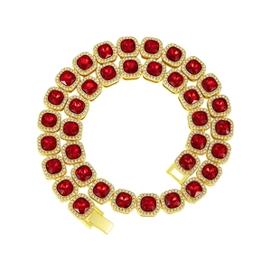Detail of gold tennis chain featuring square red stones and micro-pave zirconia settings