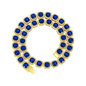 Golden tennis chain with square blue gems and white crystal pavé in a coiled display