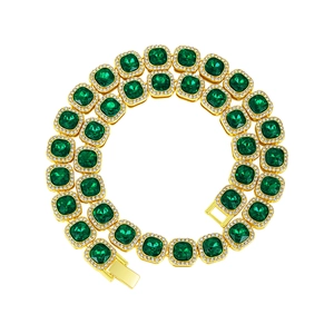 Detail of emerald cut green crystals and zircon halo on gold plated luxury chain