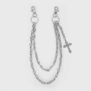 Close-up of triple-layered silver punk trousers chain with engraved cross pendant detail