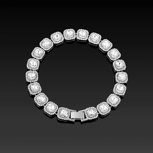 Close-up of square cut crystals and micro-pave diamonds on silver luxury bracelet