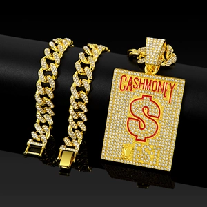 Macro view of gold-tone Cuban chain with rhinestone CASH MONEY dollar sign pendant