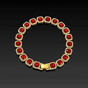 Detail of luxury gold tennis chain with cushion-cut red rubies and white zircon halo crystals