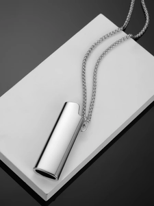 Close-up of polished silver lighter case pendant with a sleek mirror finish chain