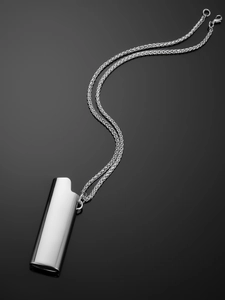 Detailed macro view of silver mirror polished hip hop lighter case pendant necklace
