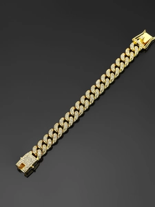 Detail eines 13mm goldfarbenen Cuba-Armbands mit Strasssteinen und Drachenverschluss