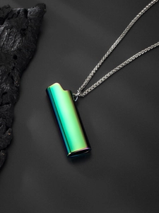 Close-up of iridescent lighter case pendant with silver wheat chain on a black background