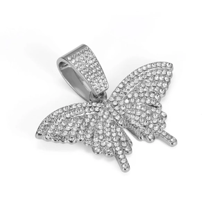 Macro shot of silver butterfly pendant featuring micro-pave crystals and oversized bail