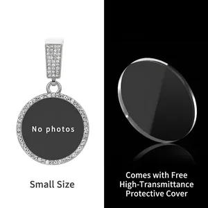 Detailed view of small round rhinestone pendant with custom photo slot and protective cover