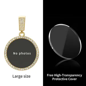 Macro shot of large golden DIY photo pendant with crystals and high-transparency cover