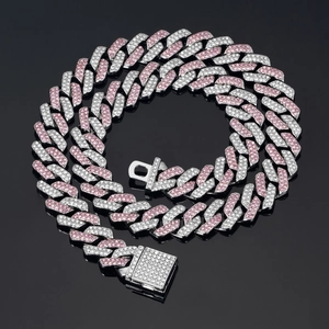 Close-up of pink and white crystal encrusted silver Cuban link chain with a box clasp