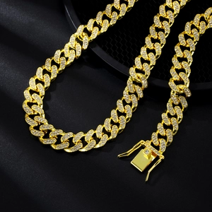 Close-up of a 13mm gold plated Cuban link necklace featuring iced-out pavé crystals