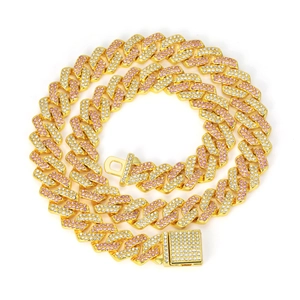 Detail of pink and white rhinestones on a gold Cuban link chain with square iced-out clasp