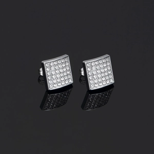 Macro detail of square iced-out earrings with silver finish and sparkling cubic zirconia stones