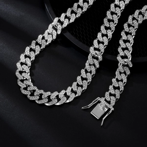 Close-up of silver Cuban link chain with crystals and secure double-sided box clasp