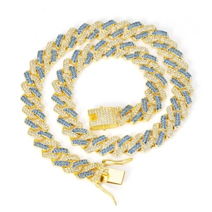 Detail of gold Cuban link chain with blue and white crystals in a staggered pattern