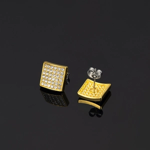 Detailed macro view of square iced-out gold earrings with butterfly back closures