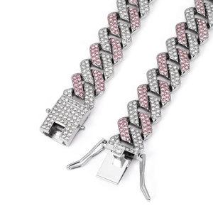 Detail of silver-tone Cuban link chain with pink and white rhinestones and secure clasp