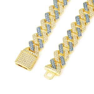 Detailed close-up of golden Cuban link chain with blue and white pavé rhinestones