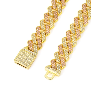 Detail of pink and white rhinestones on golden cuban link necklace with square clasp