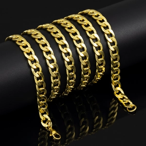 Polished 7mm golden Cuban link chain draped on black display stand with lobster clasp