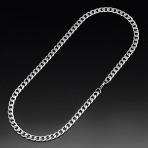 Close-up of polished silver Cuban link chain with lobster clasp on reflective black surface
