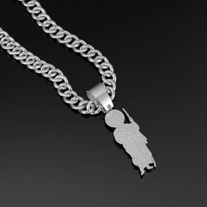 Detailed view of silver Cuban chain necklace with frosted texture on back of pendant