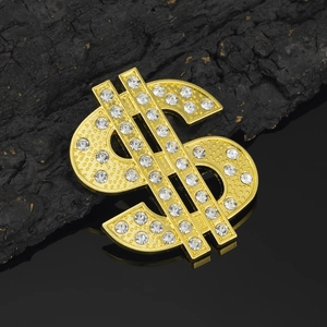 Detailed close-up of a hip-hop gold dollar sign accessory encrusted with white rhinestones