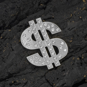 Polished silver dollar sign charm with sparkling crystals for DIY jewelry on black stone