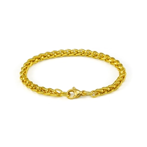 Gros plan d'un bracelet chaîne épi de 5mm en or avec une finition polie et un fermoir