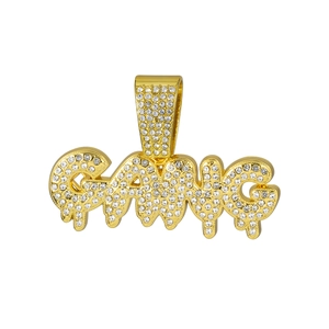 Detailed view of GANG letter pendant with liquid drip design and iced-out rhinestones