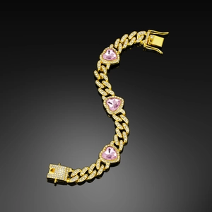 Close-up of Cuban chain necklace with pink heart stones and paved sparkling crystals