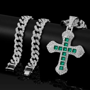 Close-up of hip hop silver necklace with emerald stones and iced-out cubic zirconia