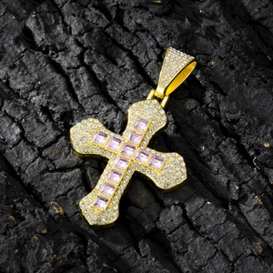 Detail of hip hop cross pendant with pink square stones and white cubic zirconia