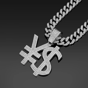 Macro shot of silver iced-out dollar and yen sign pendant on a thick cuban link chain