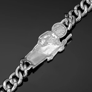 Close-up of hip hop silver Cuban link bracelet with religious Saint Jude pendant