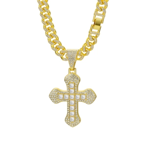 Macro view of gold iced-out hip-hop cross pendant with detailed square cubic zirconia