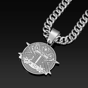 Macro detail of iced-out ICE KING pendant with silver cuban link chain for men