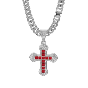 Detail showing red square gemstones on a micro-paved diamond cross pendant and Cuban link chain