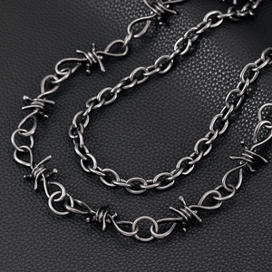 Macro view of barbed wire design on cool double-layered gunmetal black trousers chain