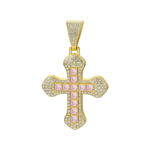 Macro shot of hip-hop cross pendant featuring 11 pink square-cut gems and gold finish