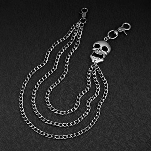 Detail view of triple-layered silver punk jeans chain with a 3D skull pendant on leather