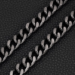 Macro shot of heavy vintage silver curb chain links with brushed metal finish for men