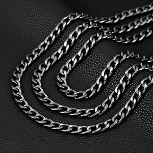 Three-layer gunmetal curb chain punk pants accessory on premium black leather surface