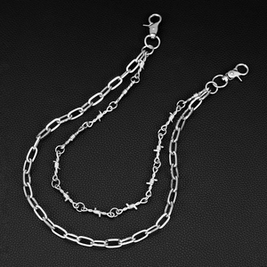 Close-up of double-layer silver punk jeans chain with lobster clasps and barbed wire link