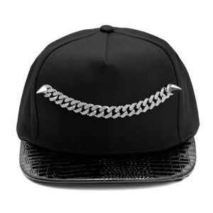 Hip hop snapback hat featuring studded cuban link chain and black faux crocodile leather brim