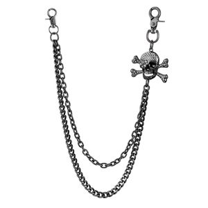 Detail of gunmetal punk pants chain featuring a rhinestone skull and crossbones charm